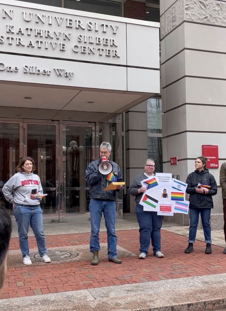 Faculty, staff and students at Boston University rally outside of the presidents’ office on Thursday, hand delivering a petition signed by over 2,000 people.